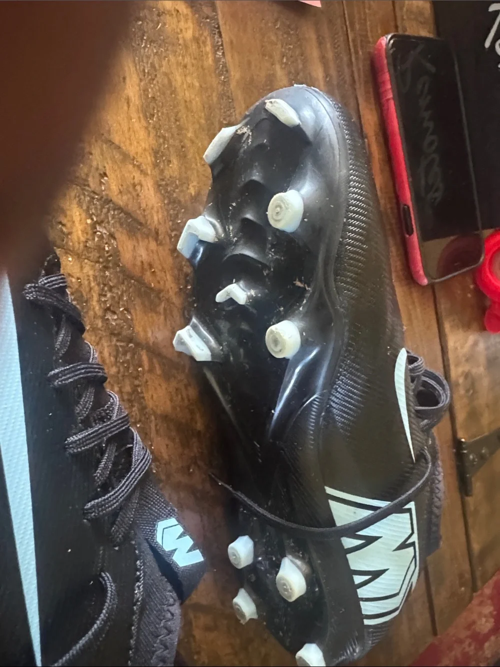 Nike Black Cleats with Light Blue Swoosh